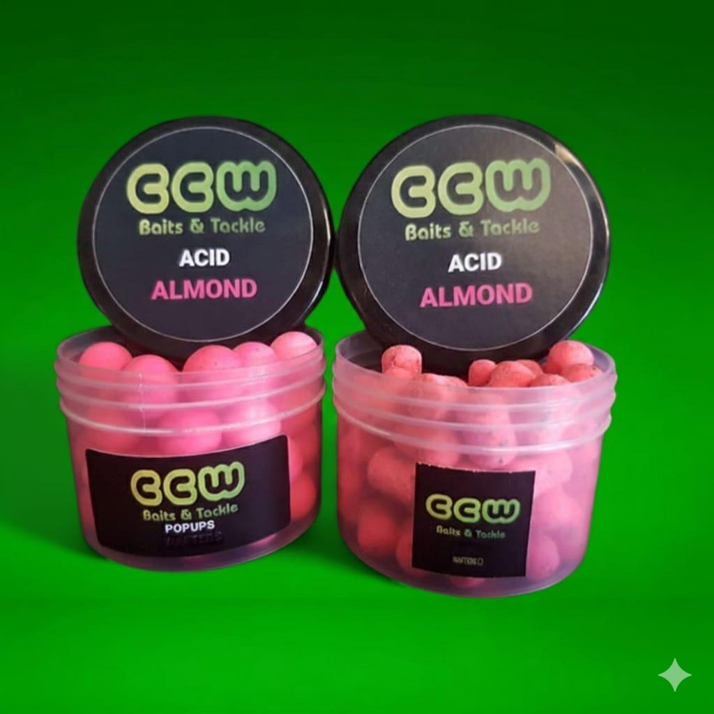 Two containers of CCW Baits & Tackle Acid Almond pop-ups on a green background