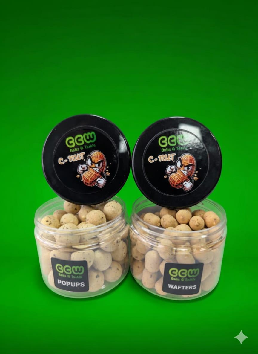 Two containers OF C - Nut Popups and Wafters on a green background