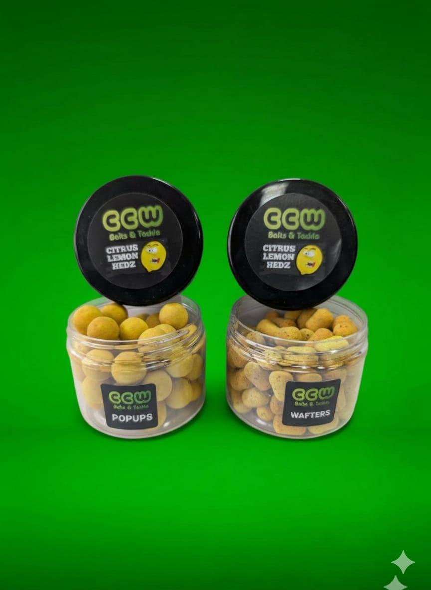 Two jars of Citrus Lemon Hedz hook baits on a green background