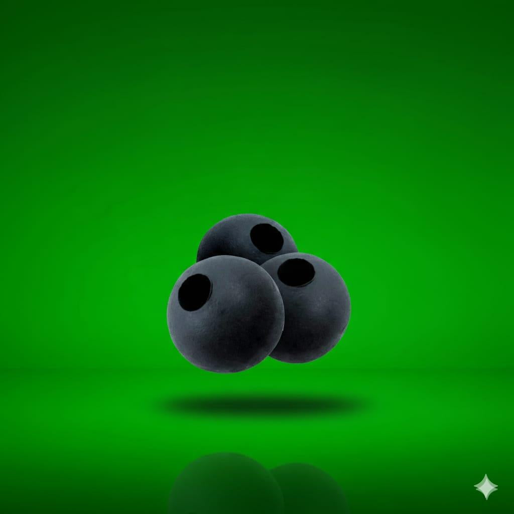 Three dark grey Dead Weight Tapered Tungsten Beads on a green background