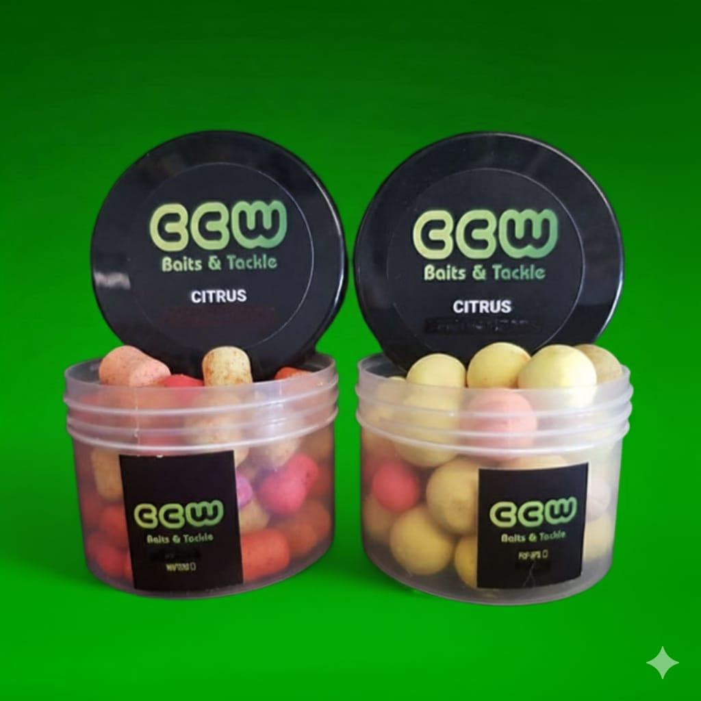 Two containers of CCW Baits & Tackle Citrus baits on a green background