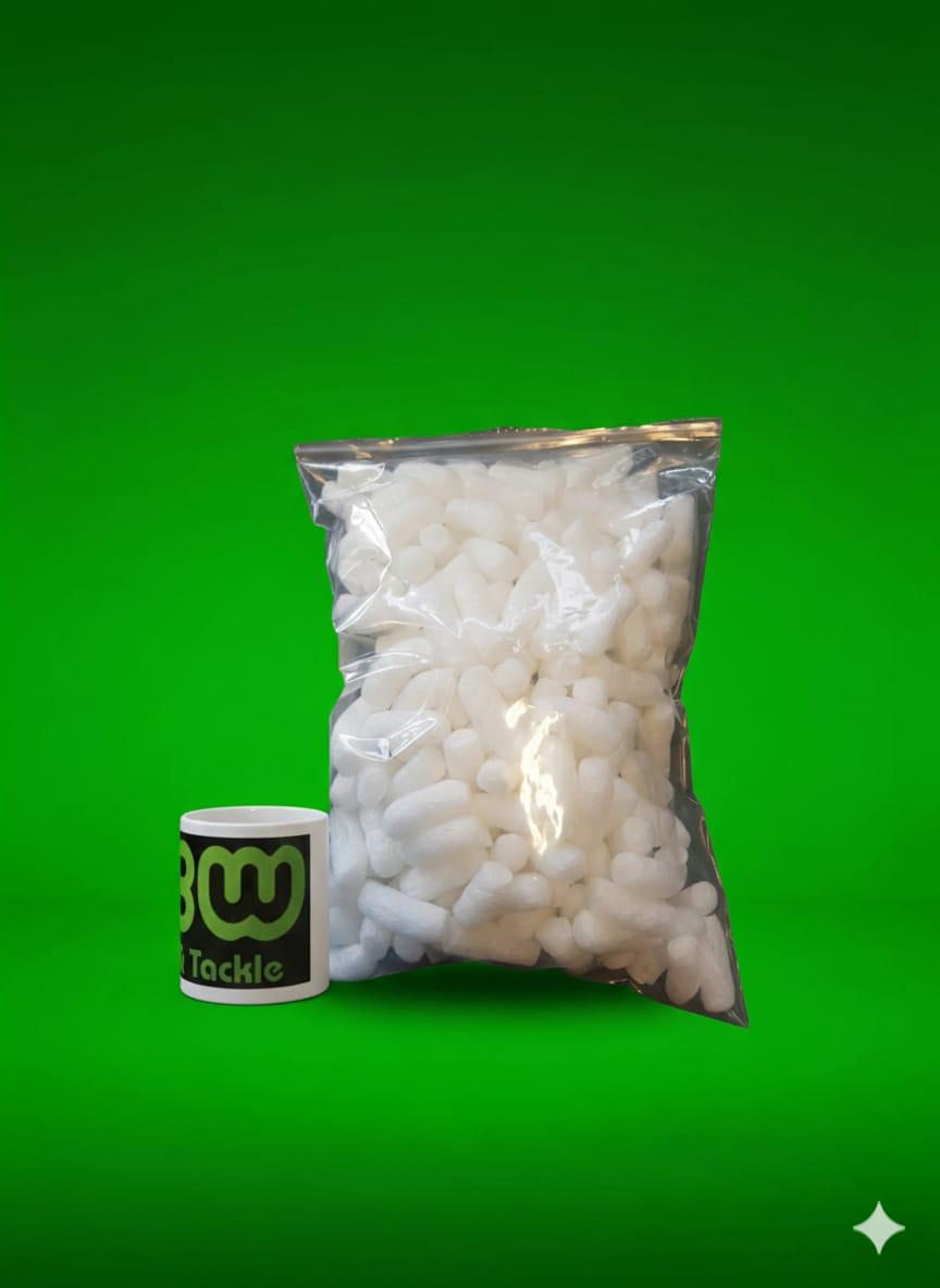 Bag of white Rig Foam Nuggets on a green background