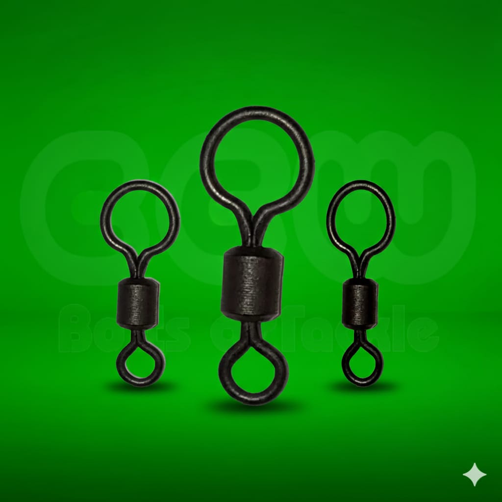 Three black fishing swivels on a green background